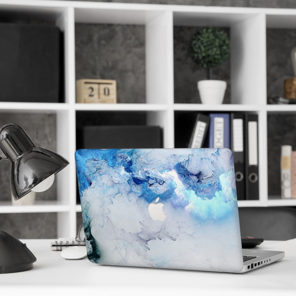 Stylish blue marble MacBook case by Zoodle on modern office desk