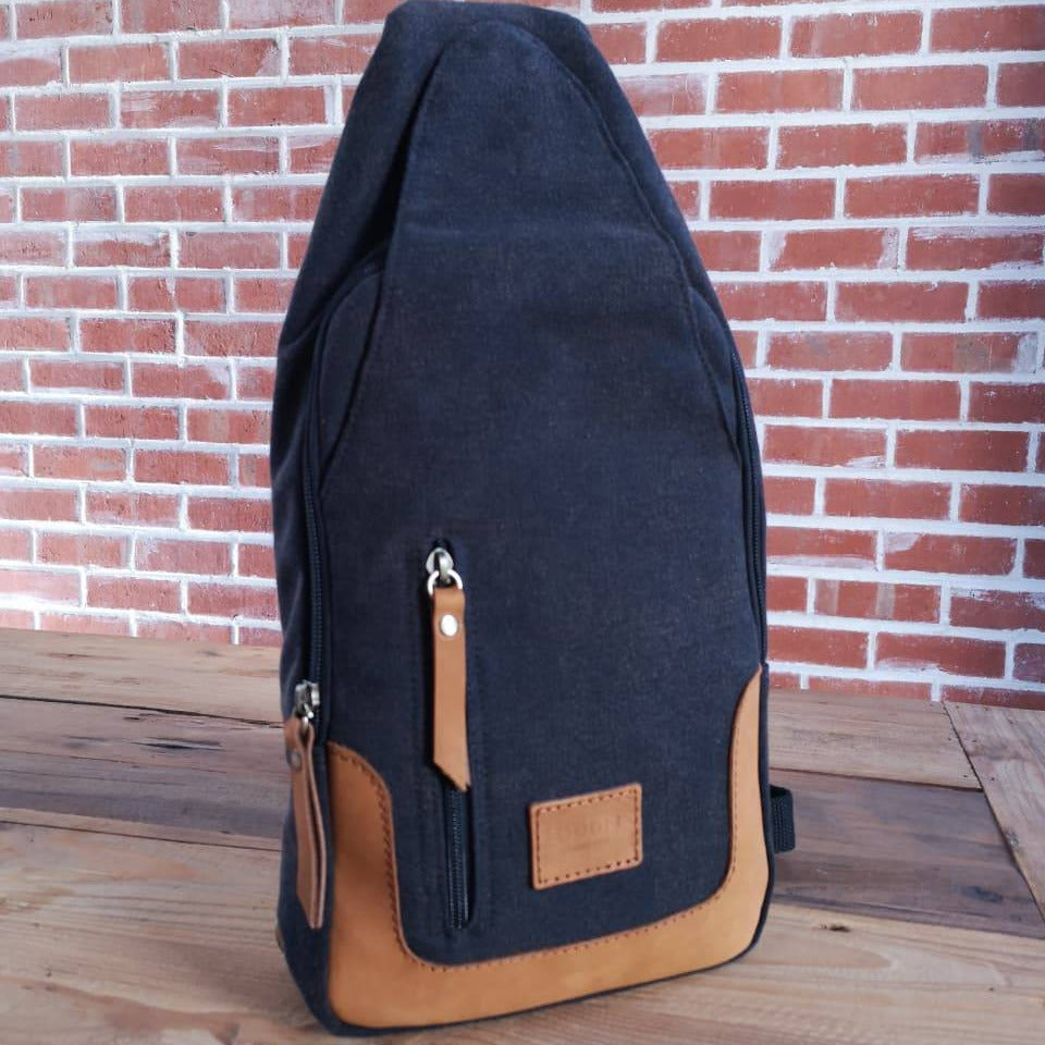 Zoodle iPad Sling Bag in charcoal canvas with tan leather accents, handmade for modern style and tech convenience in South Africa.
