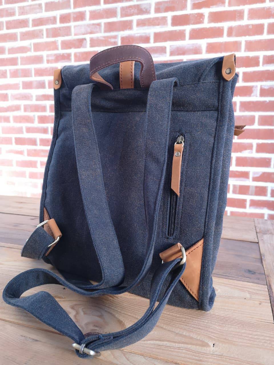 Rear view of navy Zoodle Laptop Backpack with leather zipper pull and reinforced straps, built for durability and daily use.