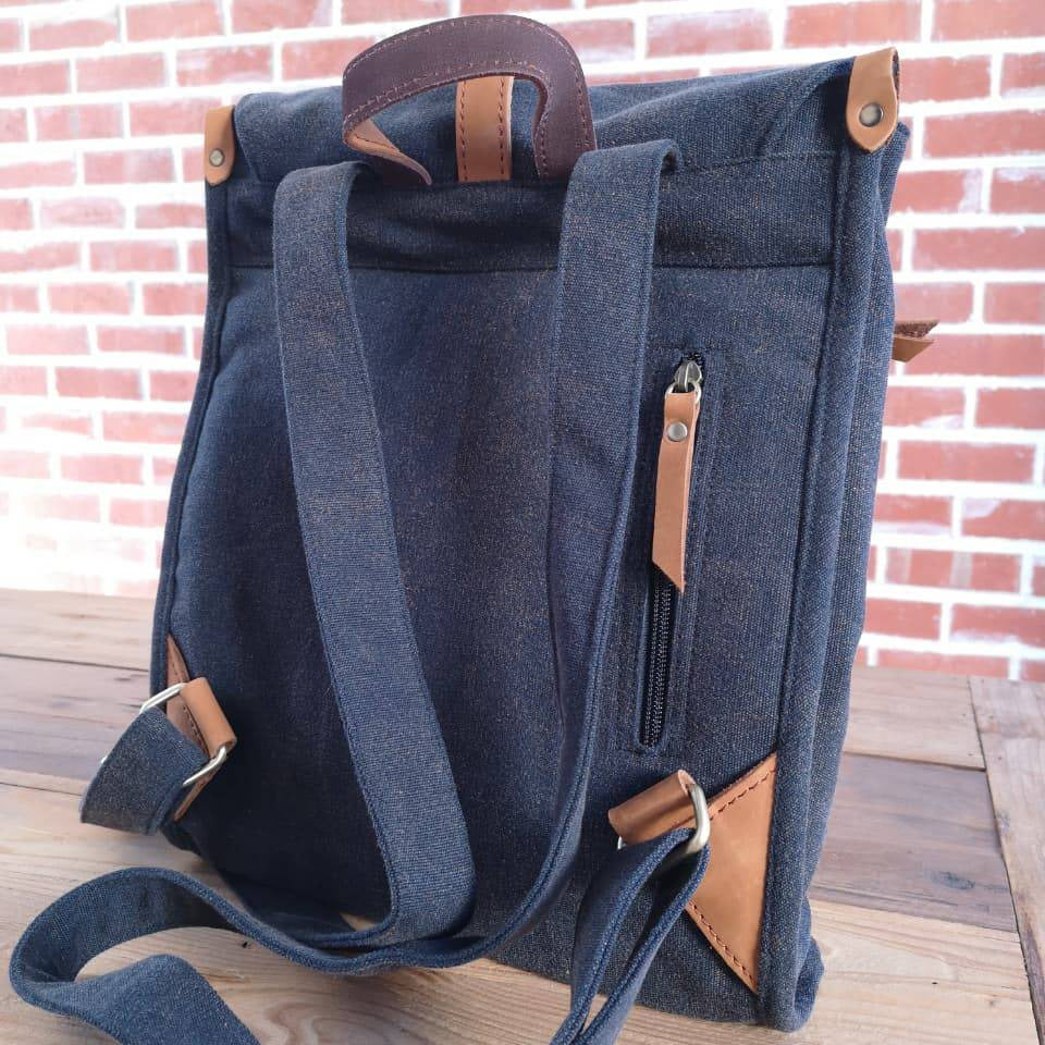 Rear view of navy Zoodle Laptop Backpack with leather zipper pull and reinforced straps, built for durability and daily use.