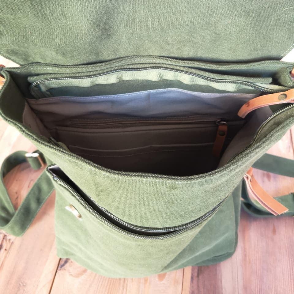 Top view of Zoodle Laptop Backpack showing zippered main compartment and organized interior pockets for daily essentials.