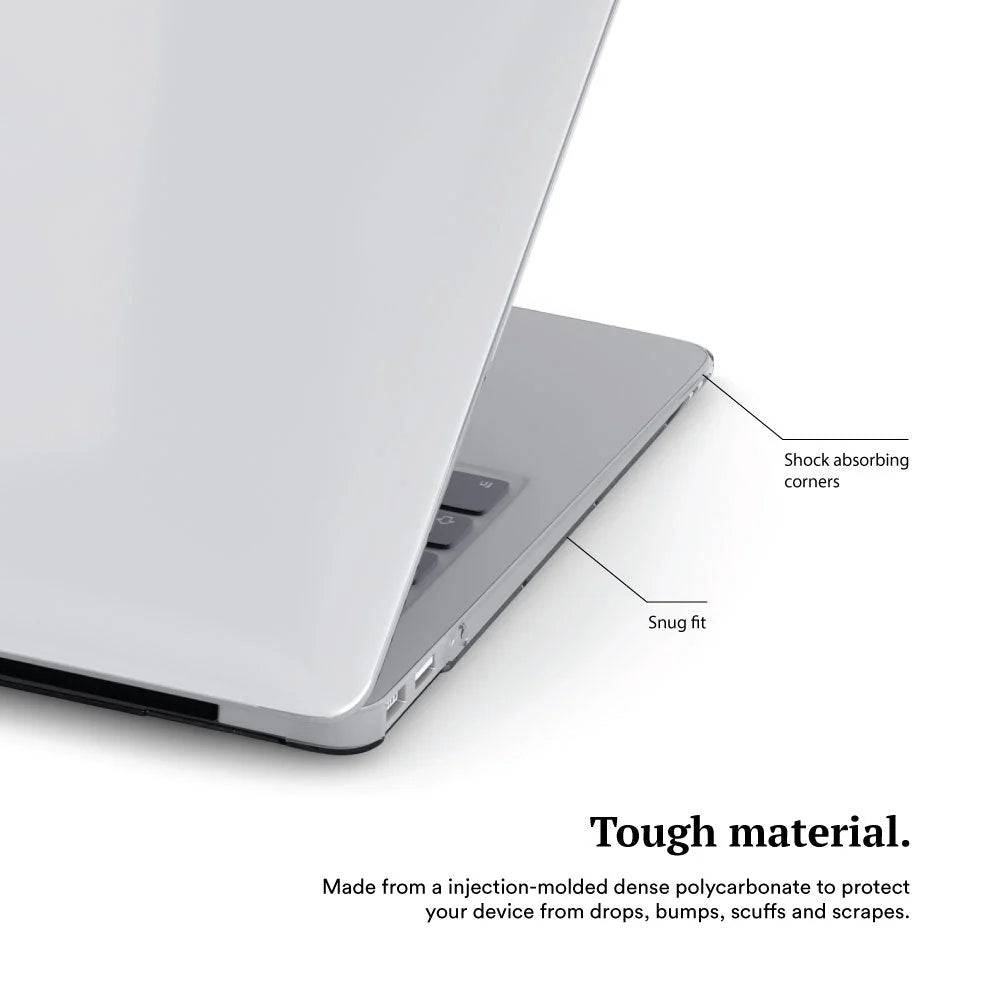 Close-up of a sleek, silver MacBook with shock absorbing corners and snug fit design, highlighting durable injection-molded polycarbonate material for protection.