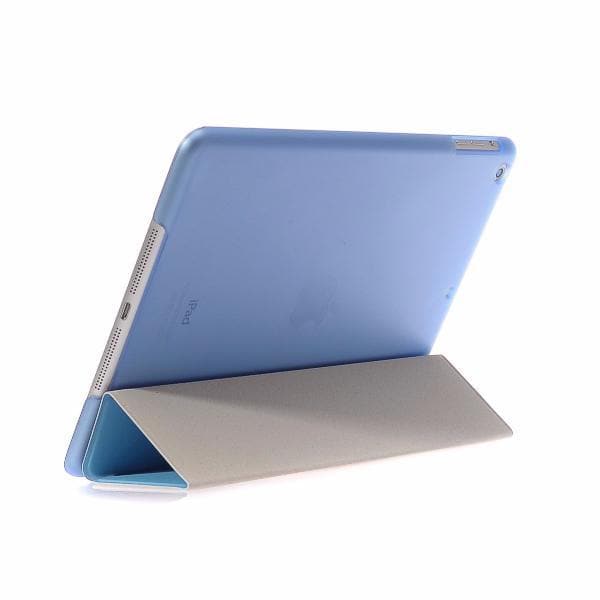Protective smart flip cover for iPad in light blue, featuring a slim design with an auto wake/sleep function. Doubles as a stand for hands-free use.