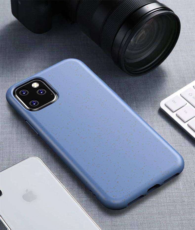 Blue Eco-Friendly Slimline iPhone Case on desk setup, featuring wheat straw texture and slim, protective design for modern users.
