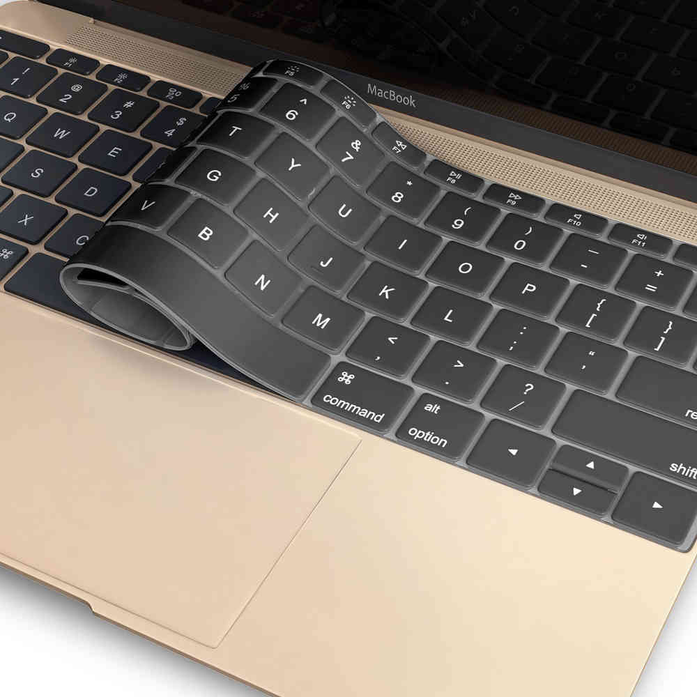 Black silicone keyboard protector on a gold MacBook keyboard.