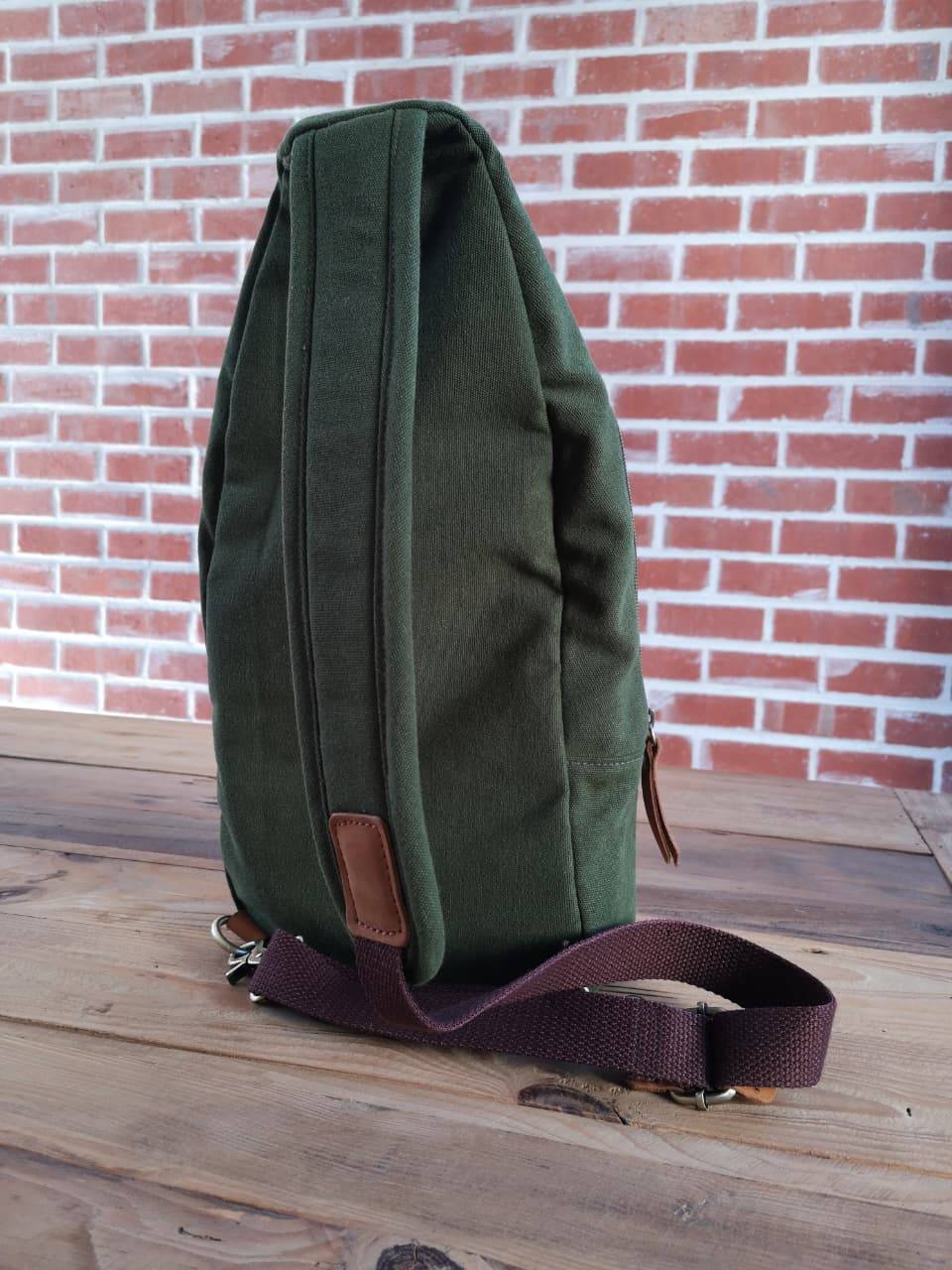 Side profile of Zoodle Olive iPad Sling Bag showing durable canvas and brown strap, designed for comfort and mobility in South Africa.