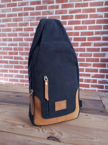 Zoodle iPad Sling Bag in charcoal canvas with tan leather accents, handmade for modern style and tech convenience in South Africa.