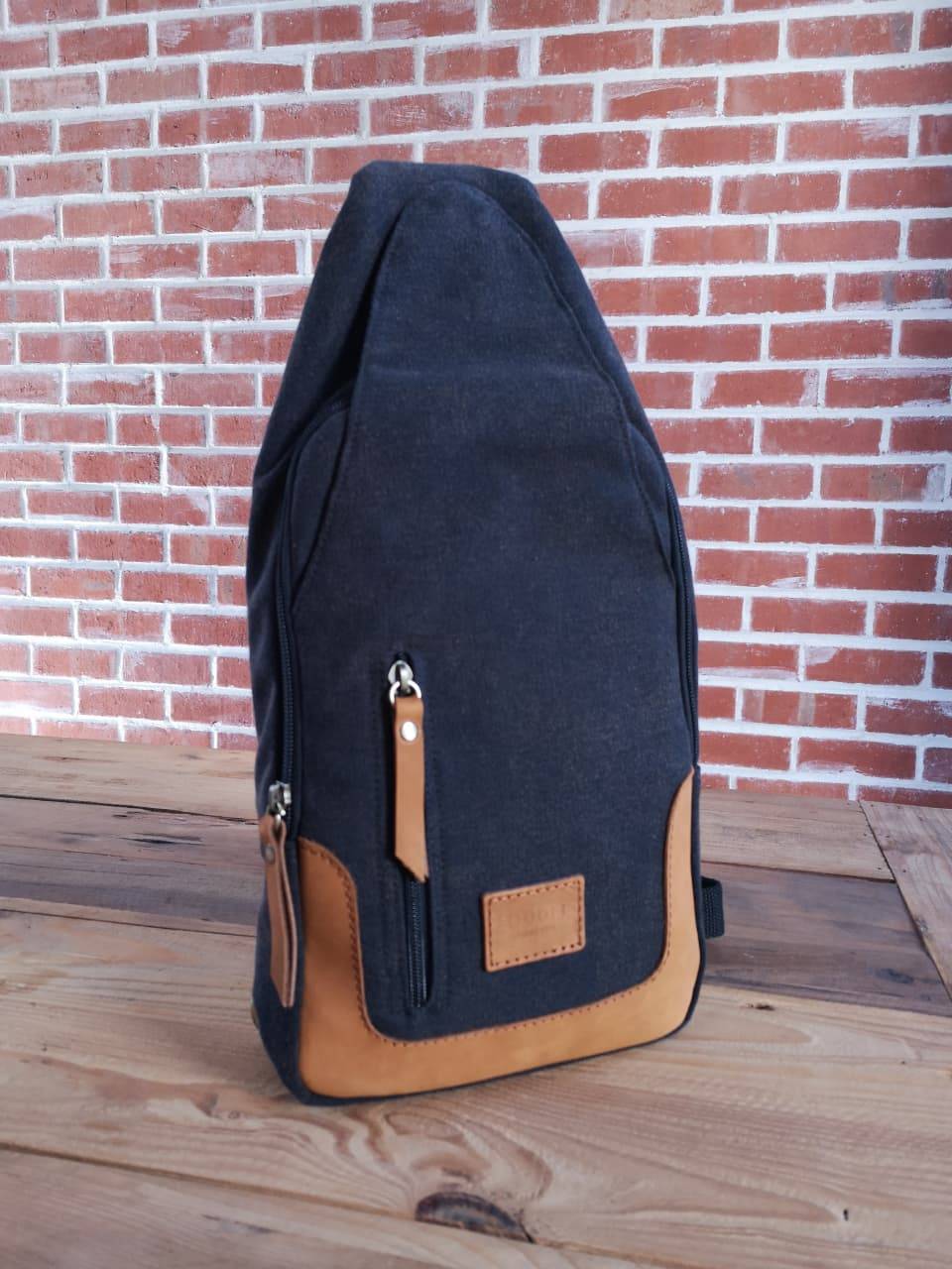 Zoodle iPad Sling Bag in charcoal canvas with tan leather accents, handmade for modern style and tech convenience in South Africa.