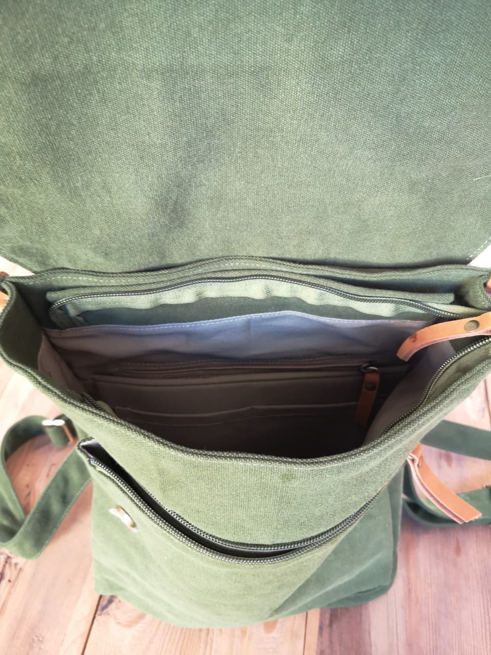 Top view of Zoodle Laptop Backpack showing zippered main compartment and organized interior pockets for daily essentials.