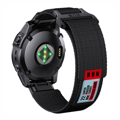 Rear view of Tactical QuickFit Strap for GARMIN in black. Rugged nylon strap with Velcro fastening and red label for 22mm Garmin watches.