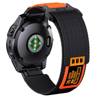 Rear view of Tactical QuickFit Strap for GARMIN in black and orange. Rugged nylon with Velcro fastening and orange label for 26mm Garmin watches.
