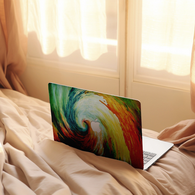 Zoodle macbook case on bed swirl colourful design