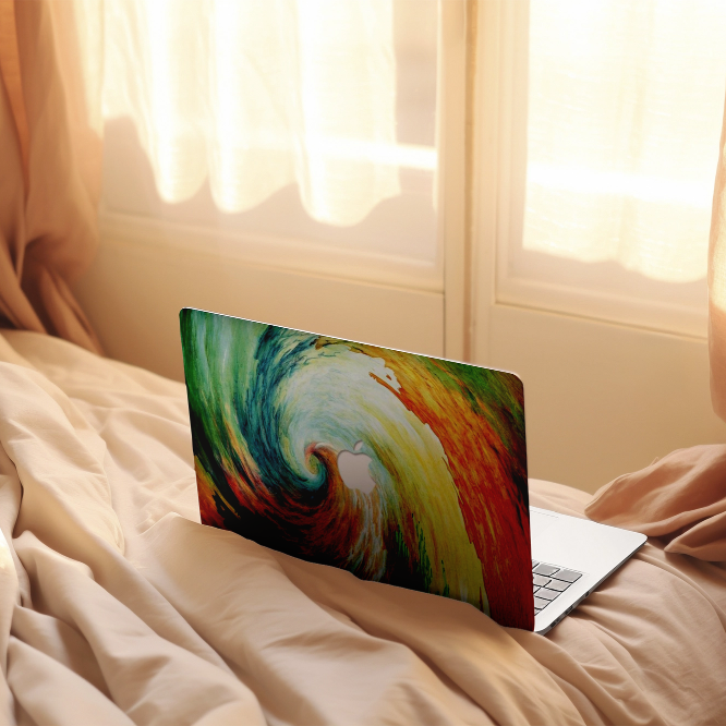 Zoodle macbook case on bed swirl colourful design